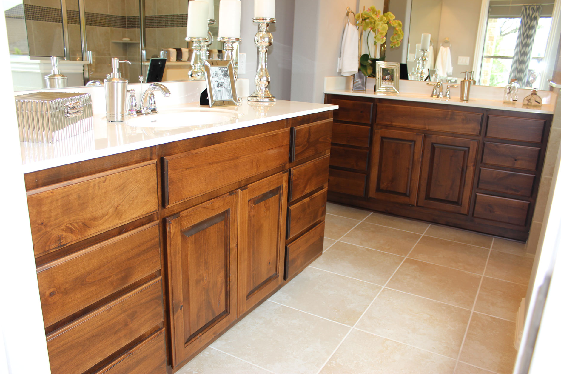 Master bath with knotty alder raised panel cabinet doors and slab drawer fronts by TaylorCraft Cabinet Door Company