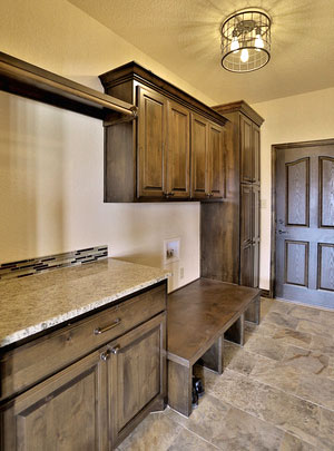 mud room cabinets with bench seat and coat closet in knotty alder