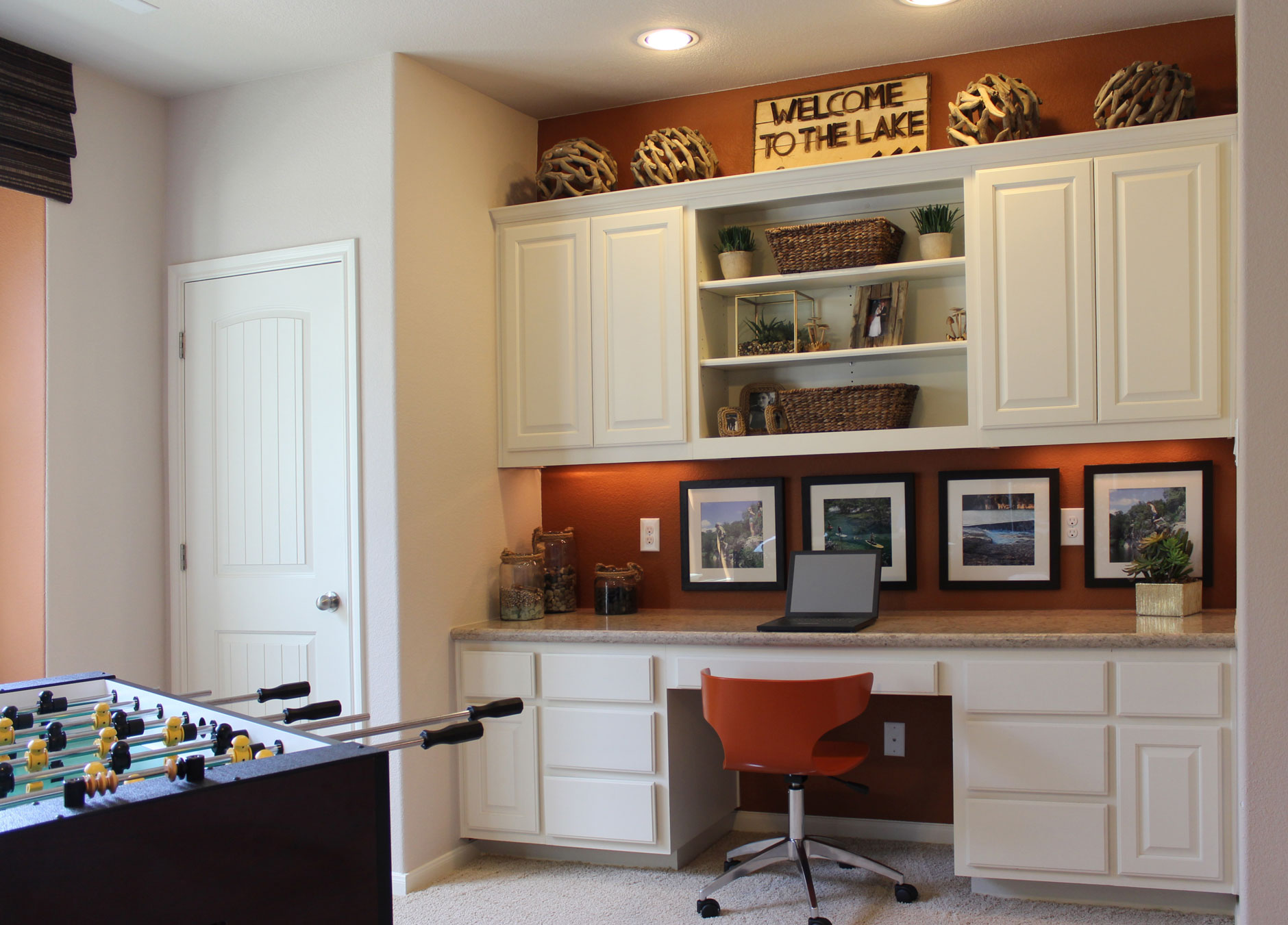 Game room workstation with raised panel cabinet doors by TaylorCraft Cabinet Door Company in paint grade hardwood