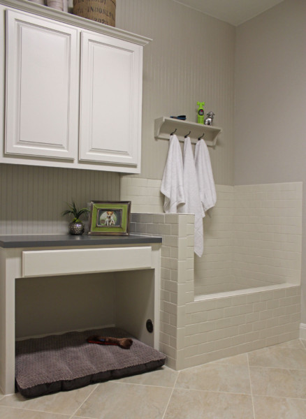 Laundry room with dog shower and space for dog bed