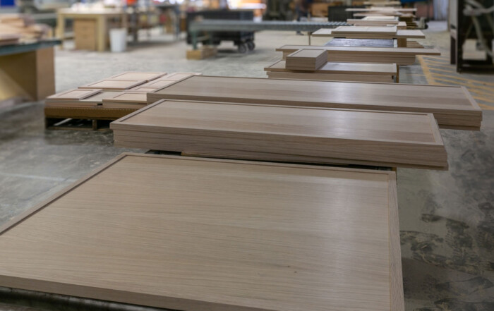 TaylorCraft cabinet door company's 4S cabinet doors on a conveyor in their woodworking shop