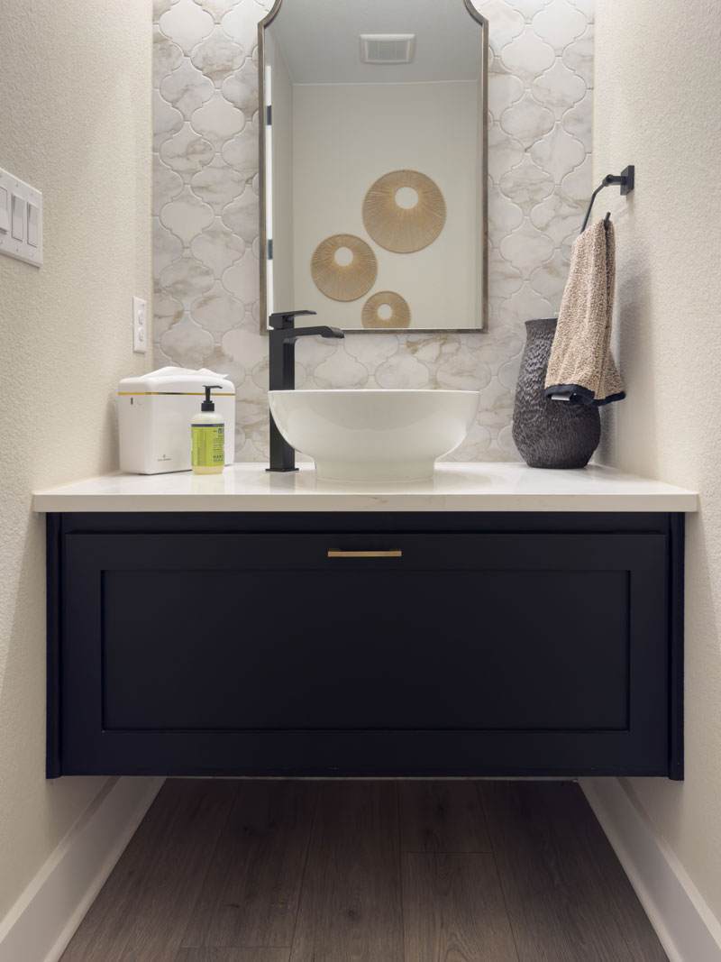 Paint grade shaker door on floating vanity in black