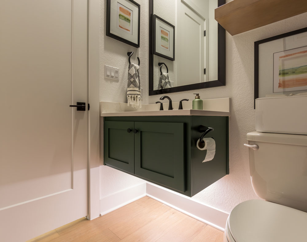 Green floating bathroom vanity with TaylorCraft's shaker cabinet doors in OE4, IE2, flat panel