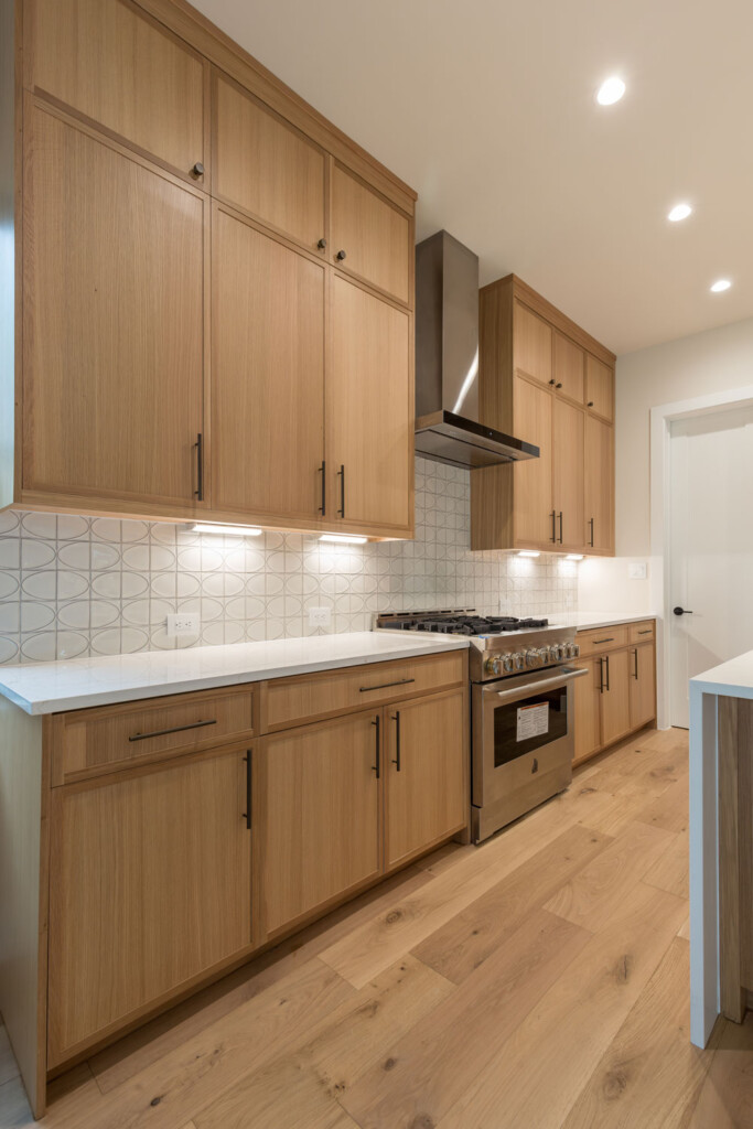 Modern-transitional kitchen cabinets in rift white oak with 4S 1" Shaker cabinet doors