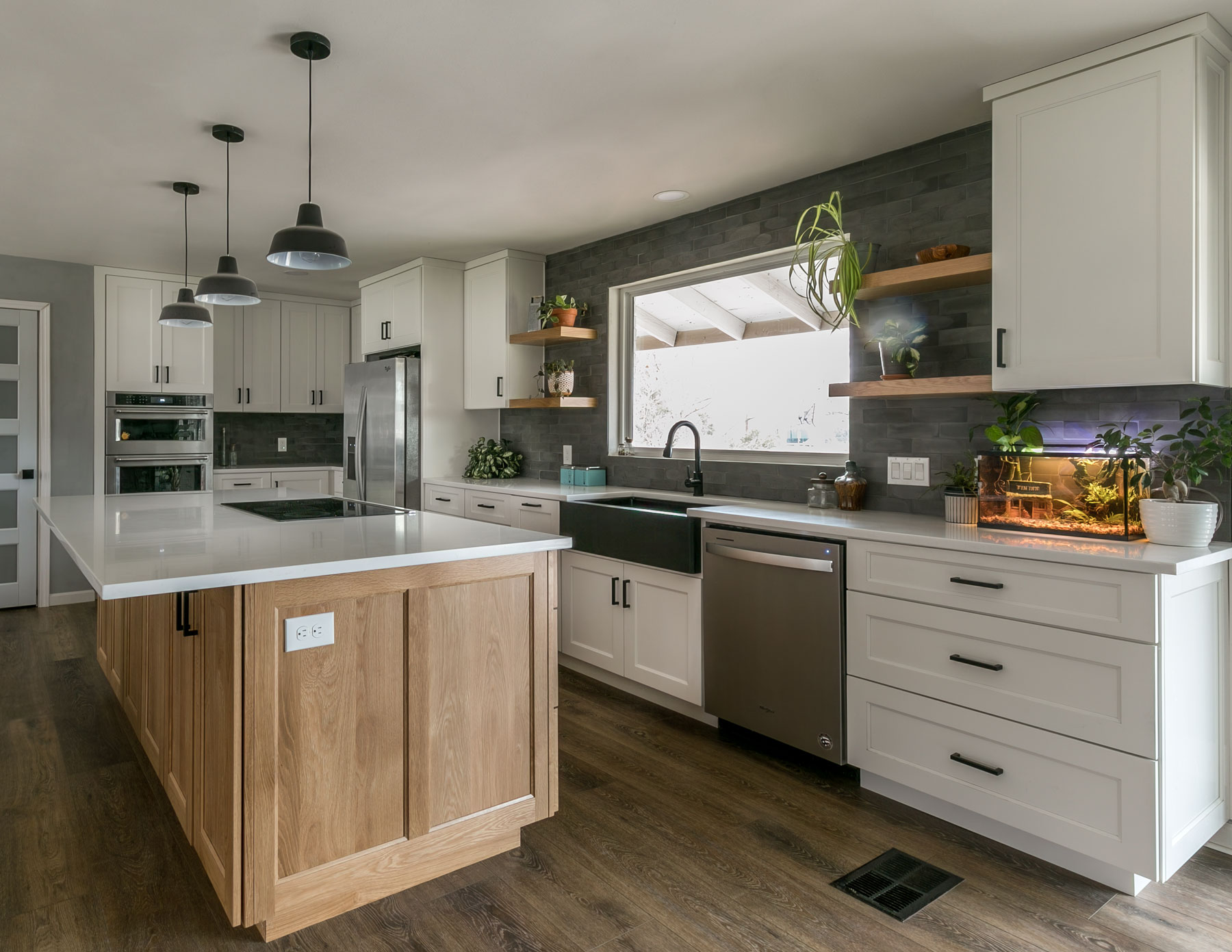 White Oak kitchen island and white perimeter cabinets with flat panel cabinet doors and drawer fronts, wide stiles, reduced rails and IE4 inside edge