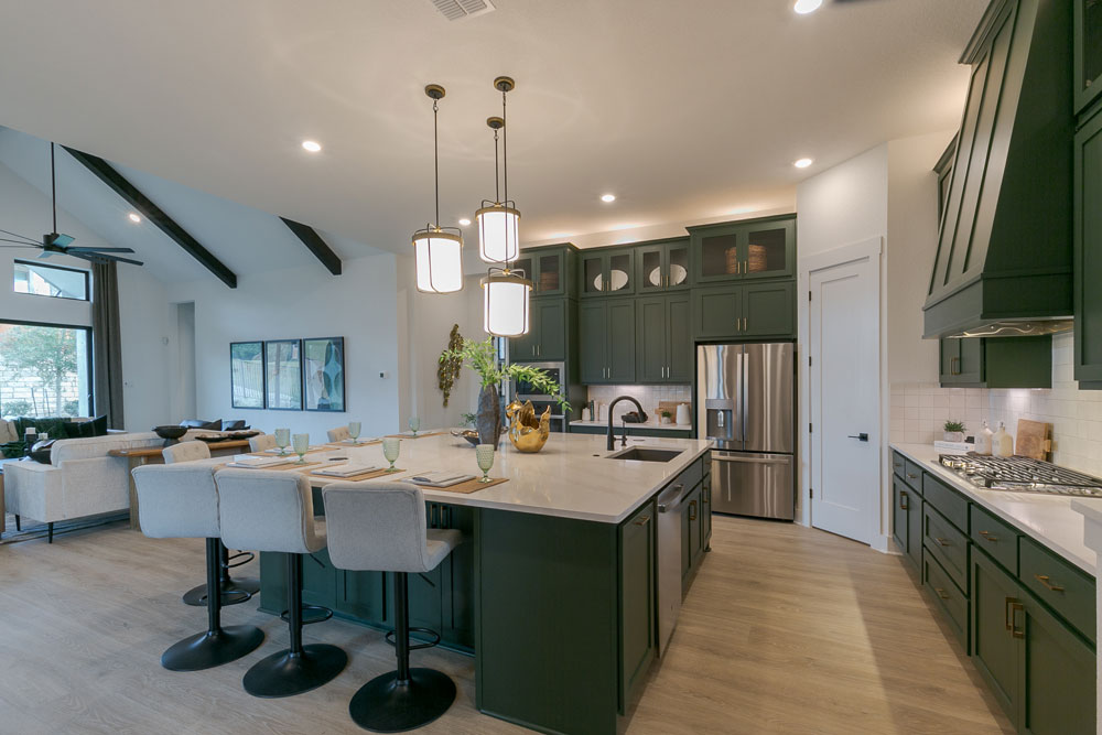 Green kitchen island and wall cabinets with OE4, IE2 flat panel shaker style cabinet doors and custom green vent hood