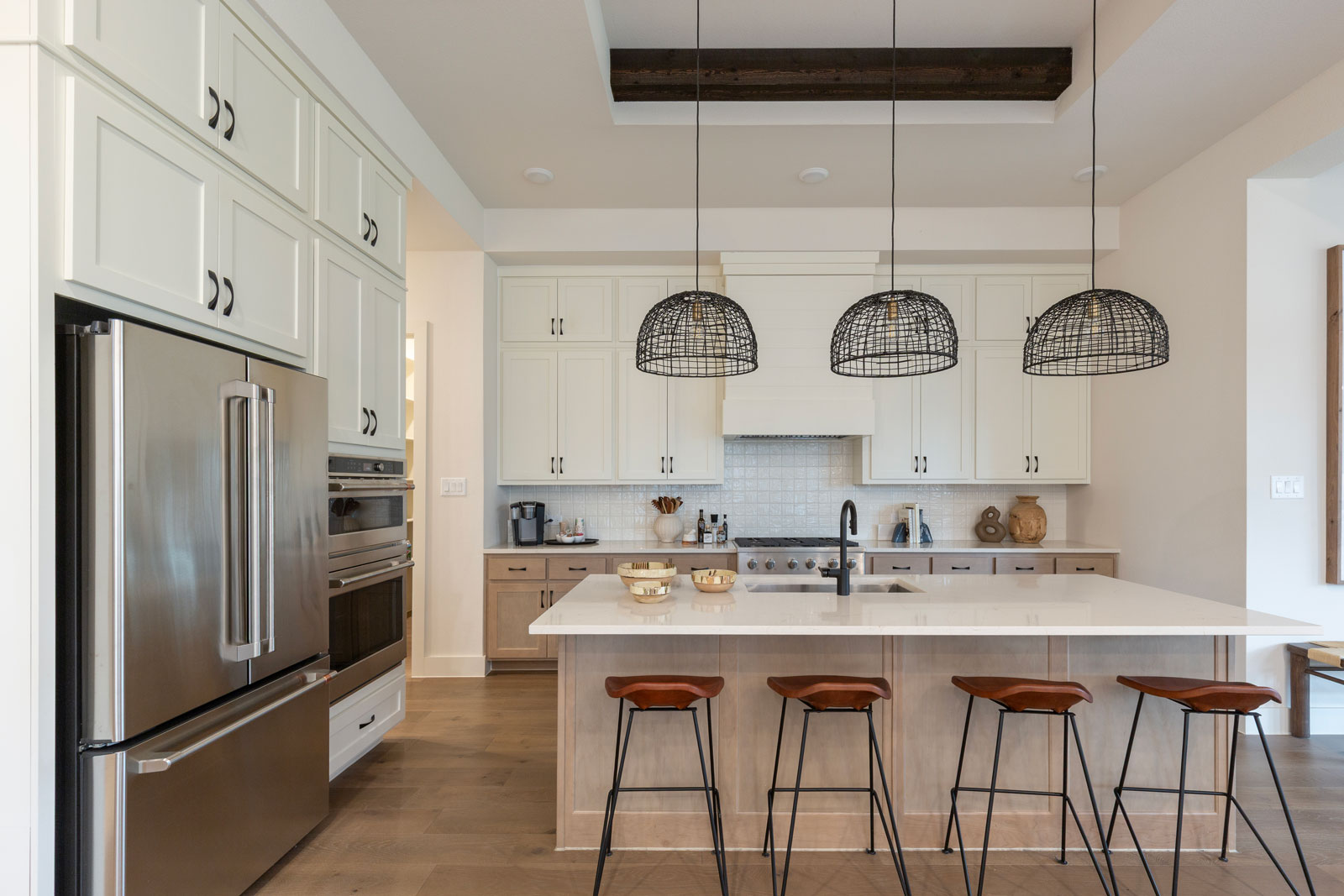 Kitchen cabinets with OE4, IE2 and flat panel maple island and base cabinet doors - paint grade upper cabinet doors in creamy warm white