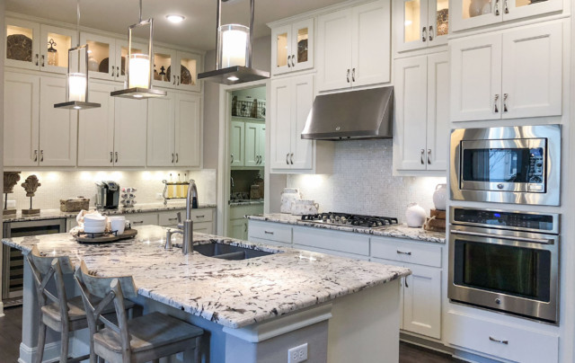 Nearly all-white kitchen with MW6, FP1/4 mitered cabinet doors by TaylorCraft