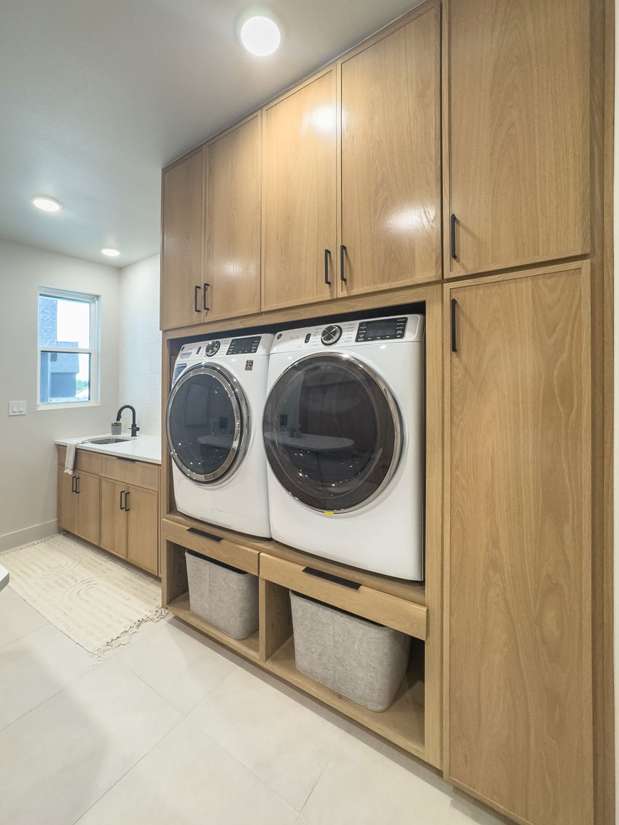 Large laundry room with built-in white oak cabinets and 4S 3/4" Shaker cabinet doors with slim frames