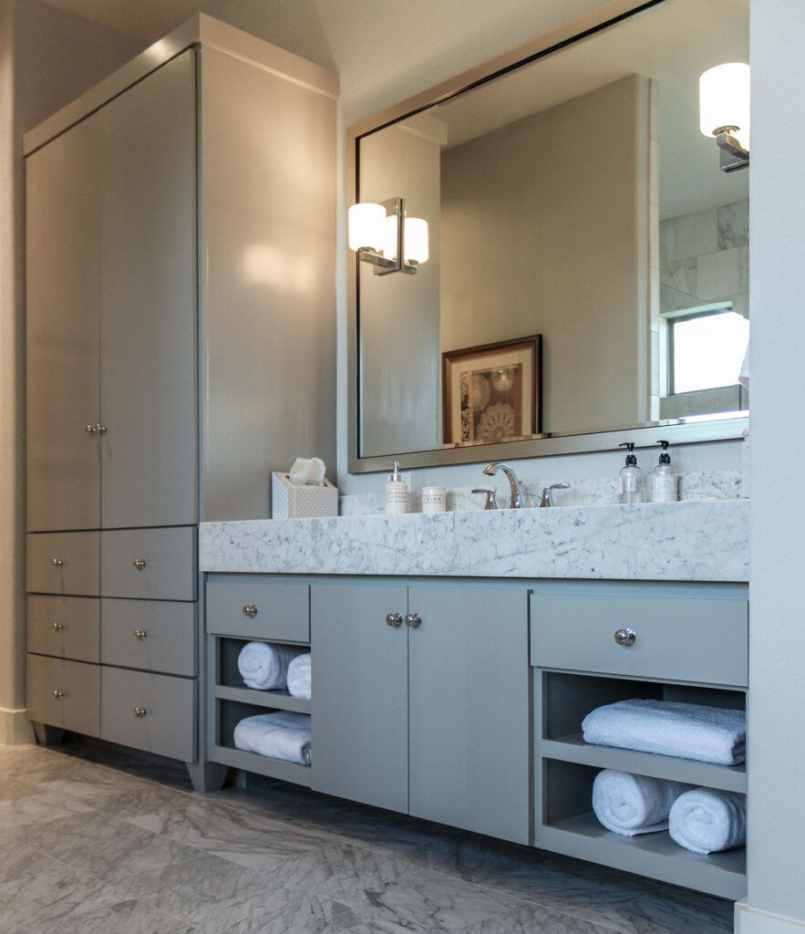 Modern bathroom cabinets with slab paint grade doors and tall linen cabinet