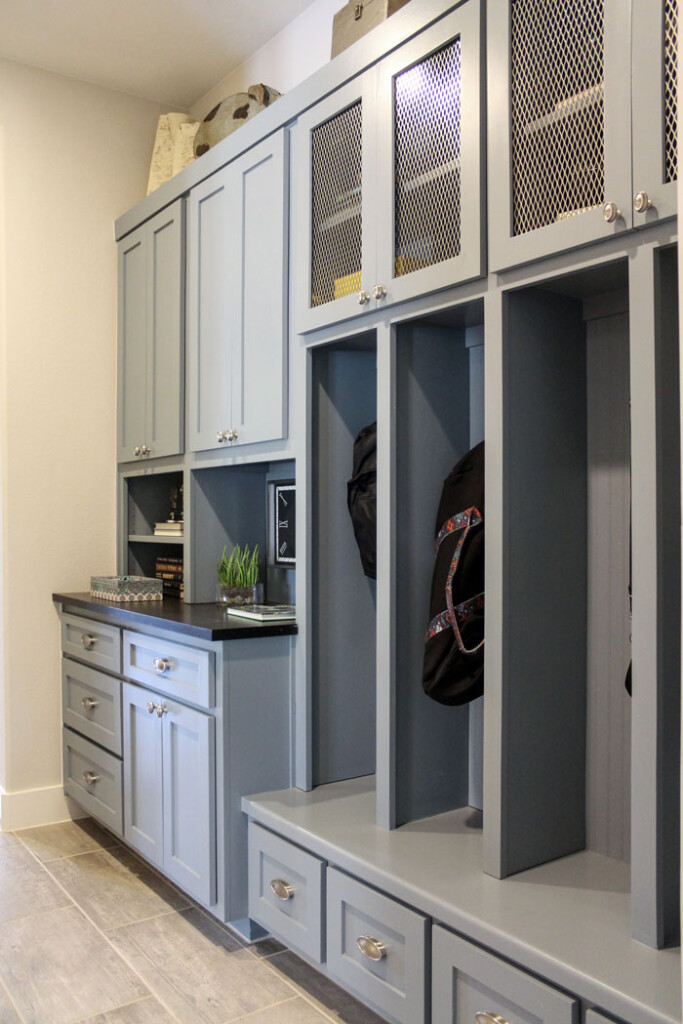 Mud room bench storage cabinets with paint grade shaker cabinet doors in light blue