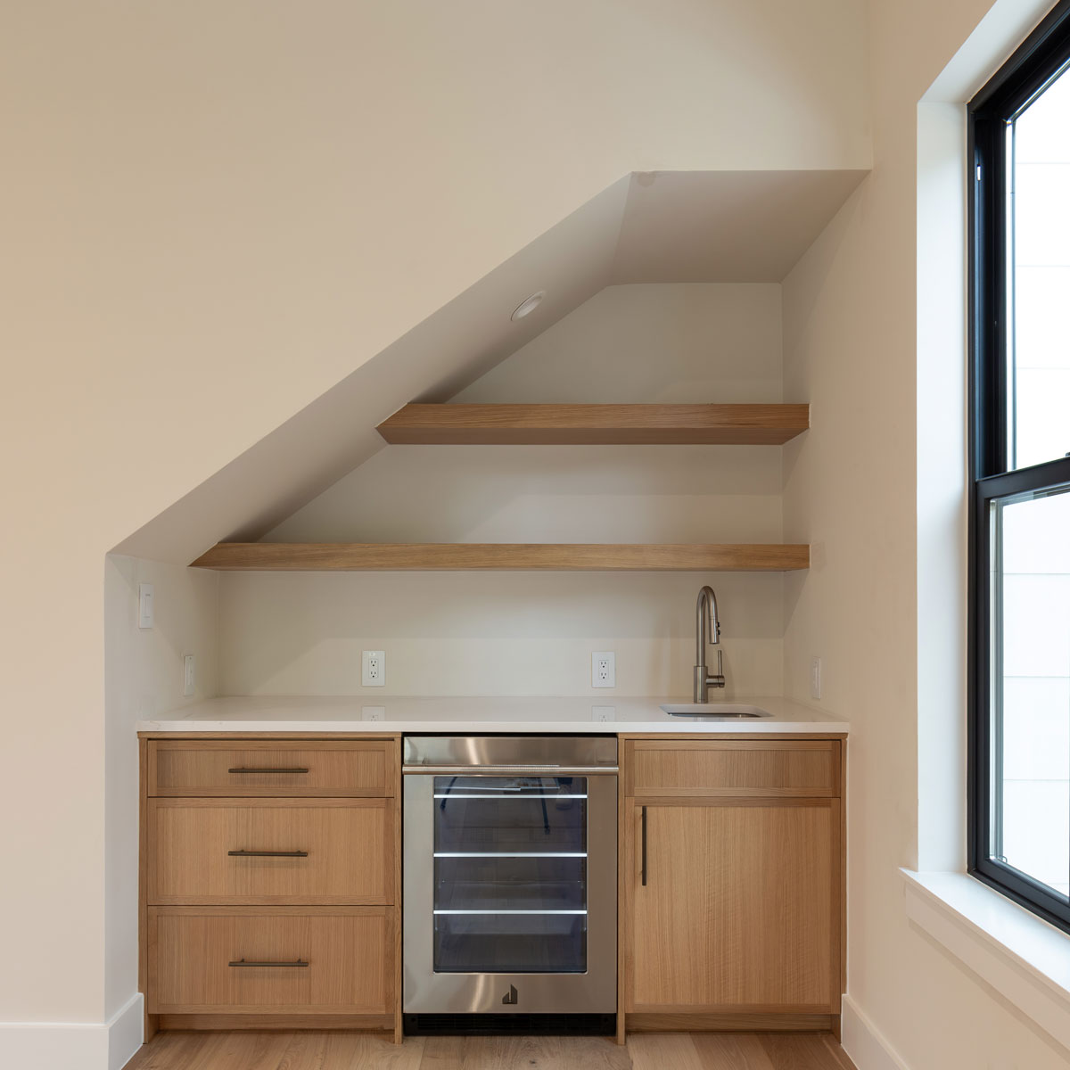 Wet Bar cabinets under stairs with 4S 3/4" Shaker doors in Rift White Oak and open shelves